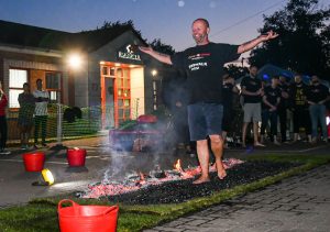 Andy Iliff Assistant Works Manager walking across hot coals