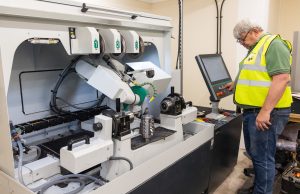 Beesley Fildes timber mill manager working on the Weinig R1000 Automatic profile straight grinding machine sml 002