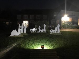 Covers donates materials to community nativity scene