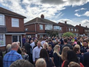 Crowds outside of families home