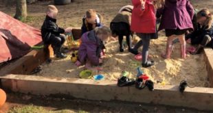 Fishbourne Primary School children enjoying their renovated sandpit.jpg FOR MEDIA