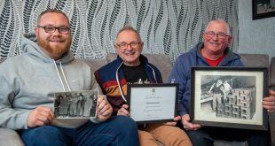 SGB 2823 left to right Robert Keith and Roy Coulson holding pictures of previous Coulson employees at Forterra