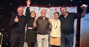 Winners of Russell Roof Tiles Quiz Burton YMCA with MD Andrew Hayward standing in the middle