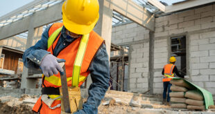 low res builders on building site sstock