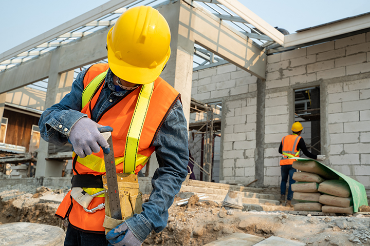 low res builders on building site sstock